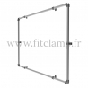 Wall mounted display frame for tension banner on aluminium tubular structure. FitClamp.